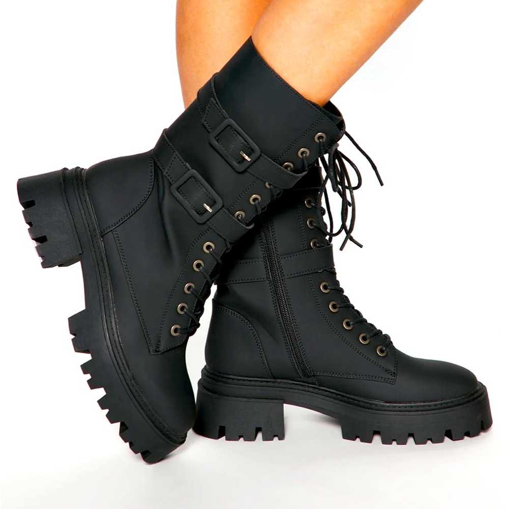 Women’s black lace up and zip combat boots. Size 7.